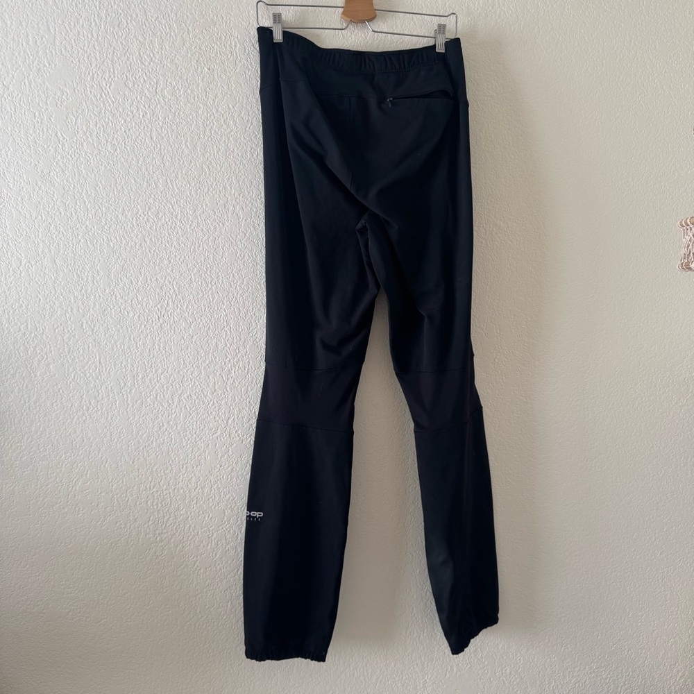 REI Co-op Cycles Cycling Pants Mens Black Nylon Waterproof Zip Ankle